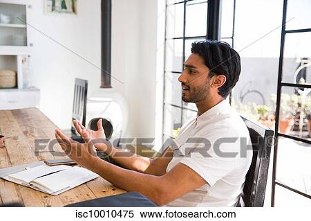 Businessman at office meeting View Large Photo Image Stock Photography - Businessman at office meeting. Fotosearch
