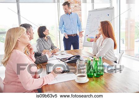 Businessman leading business meeting View Large Photo Image Stock Photography - Businessman leading business meeting. Fotosearch