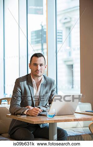 Businessman working in cafe View Large Photo Image Stock Image - Businessman working in cafe. Fotosearch