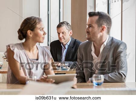 Businessmen and businesswoman working View Large Photo Image Stock Photograph - Businessmen and businesswoman working. Fotosearch