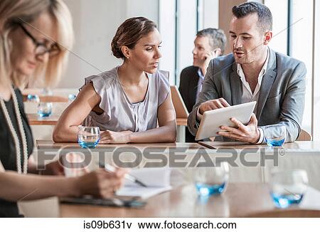 Stock Photo - Businessmen and businesswomen working. Fotosearch
