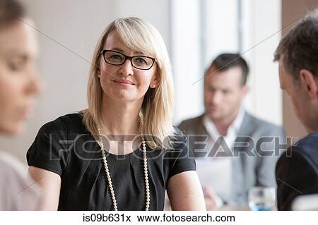 Businessmen and businesswomen working View Large Photo Image Stock Photo - Businessmen and businesswomen working. Fotosearch