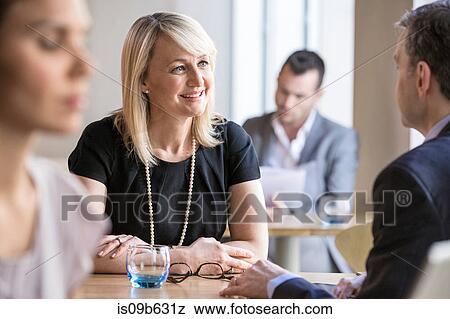 Businessmen and businesswomen working View Large Photo Image Stock Photo - Businessmen and businesswomen working. Fotosearch