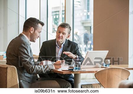 Businessmen working in cafe View Large Photo Image Picture - Businessmen working in cafe. Fotosearch