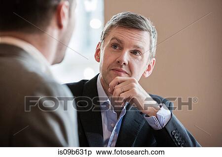 Stock Photography - Businessmen working. Fotosearch