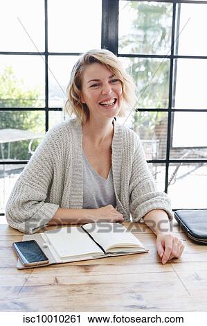 Businesswoman at office meeting View Large Photo Image Stock Image - Businesswoman at office meeting. Fotosearch