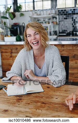 Stock Photograph - Businesswoman at office meeting. Fotosearch
