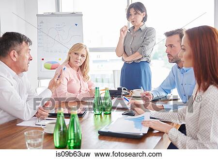 Businesswoman leading business meeting View Large Photo Image Stock Photo - Businesswoman leading business meeting. Fotosearch