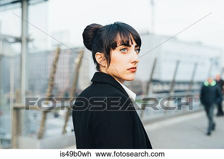 Businesswoman on pedestrian bridge, Milan, Italy View Large Photo Image Stock Image - Businesswoman on pedestrian bridge, Milan, Italy. Fotosearch