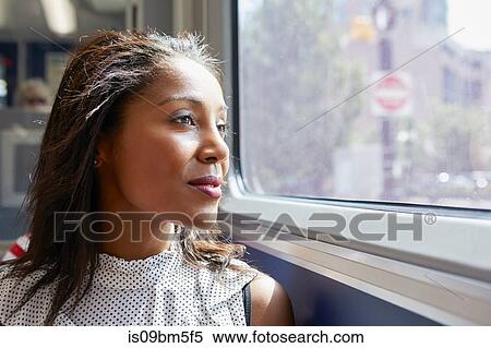 Stock Photography - Businesswoman on train. Fotosearch