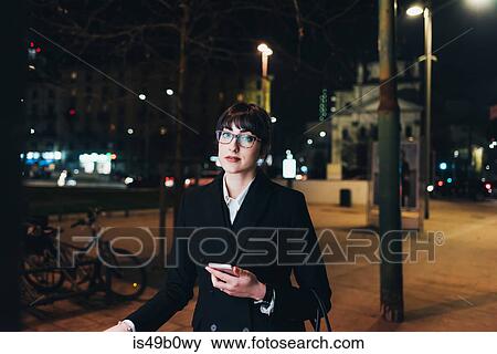 Businesswoman pulling trolley luggage, Milan, Italy View Large Photo Image Stock Photo - Businesswoman pulling trolley luggage, Milan, Italy. Fotosearch