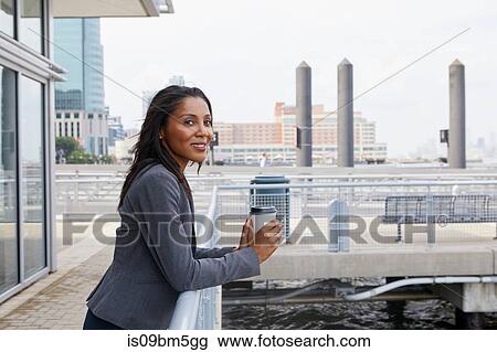 Businesswoman taking coffee break View Large Photo Image Stock Image - Businesswoman taking coffee break. Fotosearch