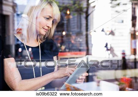 Businesswoman using digital tablet View Large Photo Image Stock Image - Businesswoman using digital tablet. Fotosearch