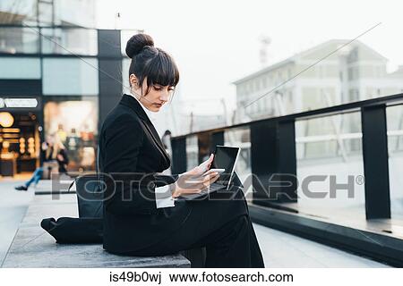 Businesswoman using digital tablet, Milan, Italy View Large Photo Image Stock Image - Businesswoman using digital tablet, Milan, Italy. Fotosearch