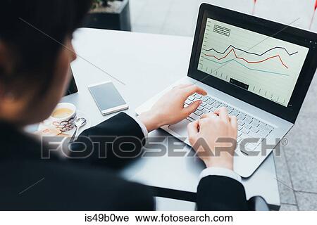 Stock Image - Businesswoman using laptop. Fotosearch