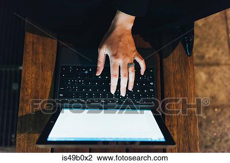 Stock Image - Businesswoman using laptop. Fotosearch