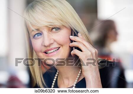 Businesswoman using mobile phone View Large Photo Image Stock Image - Businesswoman using mobile phone. Fotosearch