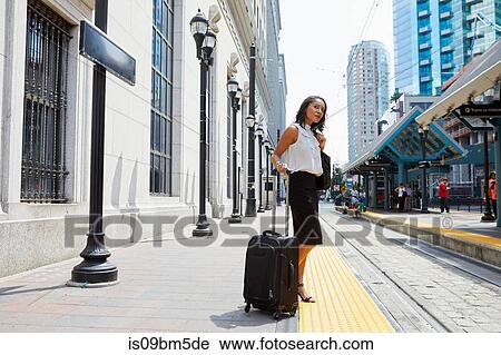 Businesswoman waiting on light rail platform View Large Photo Image Stock Image - Businesswoman waiting on light rail platform. Fotosearch