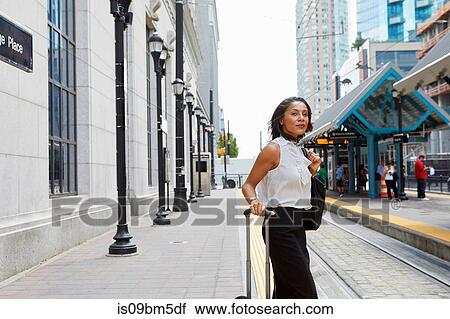 Businesswoman waiting on light rail platform View Large Photo Image Stock Image - Businesswoman waiting on light rail platform. Fotosearch