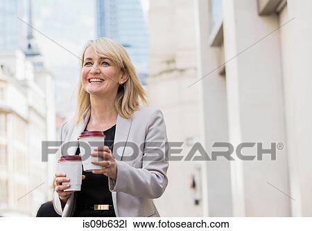 Businesswoman with coffee cups View Large Photo Image Stock Image - Businesswoman with coffee cups. Fotosearch