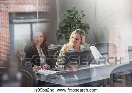 Businesswomen at meeting in office View Large Photo Image Stock Image - Businesswomen at meeting in office. Fotosearch