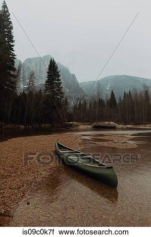 Canoe beached on river shallows, Yosemite Village, California, USA View Large Photo Image Stock Image - Canoe beached on river shallows, Yosemite Village, California, USA. Fotosearch