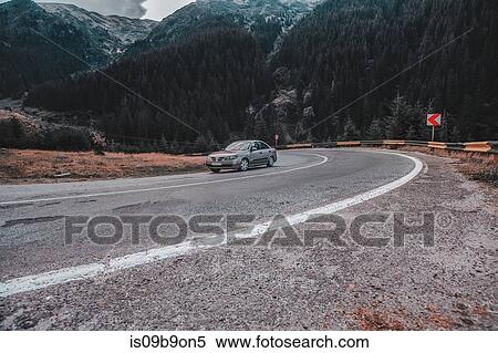 Car driving on mountain highway, Draja, Vaslui, Romania View Large Photo Image Stock Photography - Car driving on mountain highway, Draja, Vaslui, Romania. Fotosearch