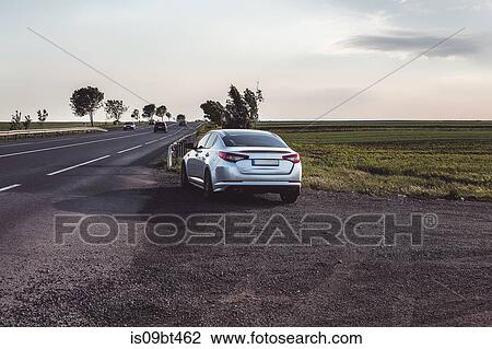 Car parked on roadside by fields, Francenigo, Veneto, Italy View Large Photo Image Stock Image - Car parked on roadside by fields, Francenigo, Veneto, Italy. Fotosearch