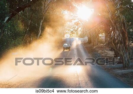 Car travelling on road, Sevenhill, Clare Valley, South Australia, Australia View Large Photo Image Picture - Car travelling on road, Sevenhill, Clare Valley, South Australia, Australia. Fotosearch