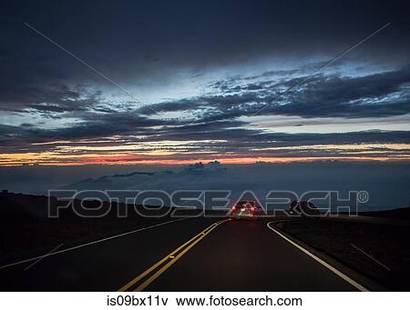 Cars travelling at night, Haleakala, Maui, Hawaii View Large Photo Image Stock Photo - Cars travelling at night, Haleakala, Maui, Hawaii. Fotosearch