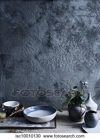 Ceramic bowls and vases against background of unfinished wall View Large Photo Image Stock Image - Ceramic bowls and vases against background of unfinished wall. Fotosearch
