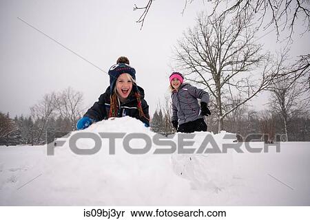 Children playing in snow View Large Photo Image Stock Photography - Children playing in snow. Fotosearch