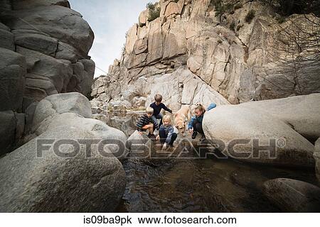 Children playing on rocks in river, Lake Arrowhead, California, USA View Large Photo Image Stock Image - Children playing on rocks in river, Lake Arrowhead, California, USA. Fotosearch