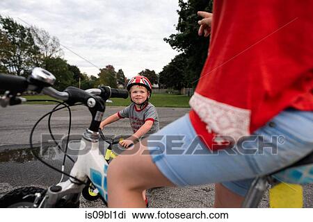 Children riding bicycles on wet road View Large Photo Image Stock Image - Children riding bicycles on wet road. Fotosearch