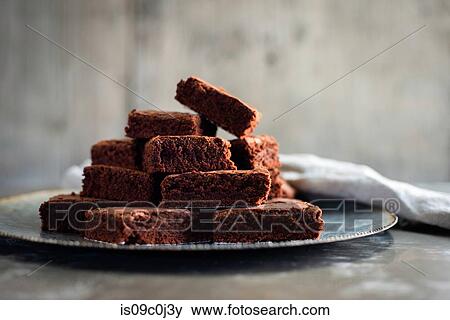 Chocolate brownies on plate with napkin View Large Photo Image Stock Photo - Chocolate brownies on plate with napkin. Fotosearch