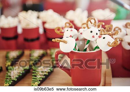 Christmas lollipops and christmas tree biscuits on chopping board View Large Photo Image Stock Photography - Christmas lollipops and christmas tree biscuits on chopping board. Fotosearch