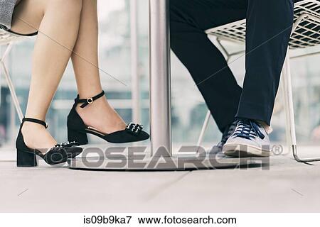 City businessman and woman meeting at sidewalk cafe, legs View Large Photo Image Stock Photo - City businessman and woman meeting at sidewalk cafe, legs. Fotosearch
