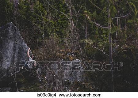 Climber bouldering in forest, Squamish, Canada View Large Photo Image Picture - Climber bouldering in forest, Squamish, Canada. Fotosearch