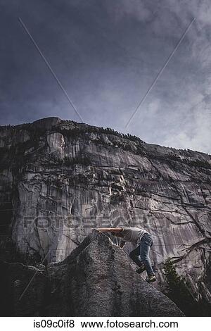 Climber bouldering in forest, Squamish, Canada View Large Photo Image Stock Photo - Climber bouldering in forest, Squamish, Canada. Fotosearch