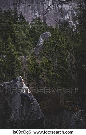 Climber bouldering in forest, Squamish, Canada View Large Photo Image Stock Photograph - Climber bouldering in forest, Squamish, Canada. Fotosearch