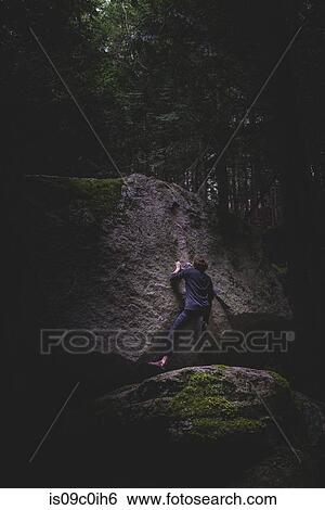 Climber bouldering in forest, Squamish, Canada View Large Photo Image Stock Photograph - Climber bouldering in forest, Squamish, Canada. Fotosearch