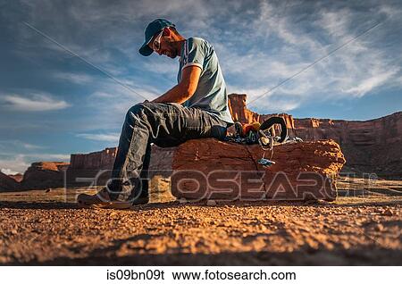Climber reading book on rock climbing route, Canyonlands National Park, Moab, Utah, USA View Large Photo Image Stock Photograph - Climber reading book on rock climbing route, Canyonlands National Park, Moab, Utah, USA. Fotosearch