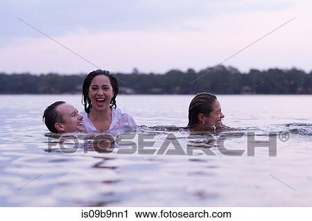 Clothed friends in water, Destin, Florida, United States, North America View Large Photo Image Stock Image - Clothed friends in water, Destin, Florida, United States, North America. Fotosearch