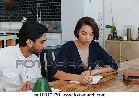 Colleagues having discussion in office View Large Photo Image Stock Image - Colleagues having discussion in office. Fotosearch