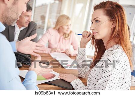 Colleagues having discussion in business meeting View Large Photo Image Stock Image - Colleagues having discussion in business meeting. Fotosearch
