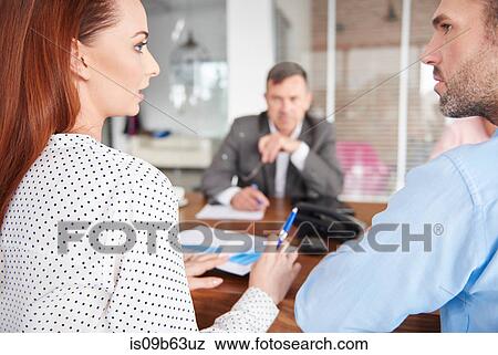 Colleagues having discussion in business meeting View Large Photo Image Stock Photo - Colleagues having discussion in business meeting. Fotosearch