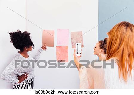 Colleagues in creative studio discussing swatches View Large Photo Image Stock Image - Colleagues in creative studio discussing swatches. Fotosearch