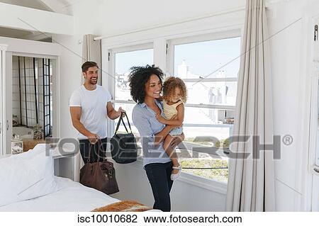 Couple and daughter leaving bedroom in beach house View Large Photo Image Stock Image - Couple and daughter leaving bedroom in beach house. Fotosearch