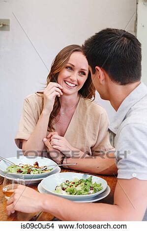 Couple having salad lunch View Large Photo Image Picture - Couple having salad lunch. Fotosearch