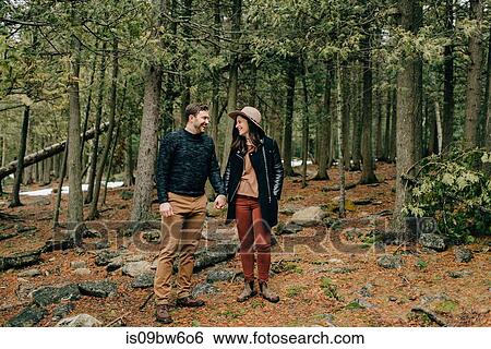 Stock Photograph - Couple hiking in forest, Tobermory, Canada. Fotosearch
